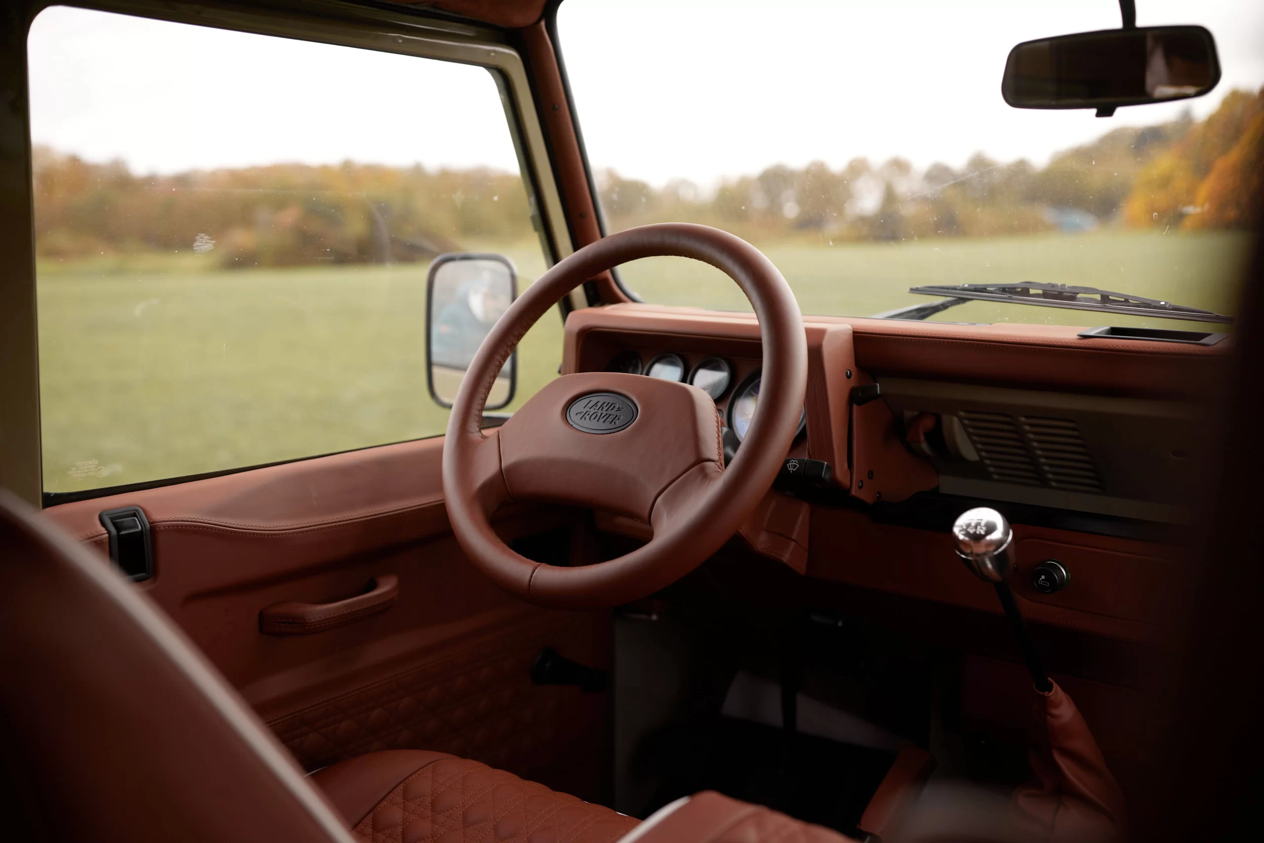 Saddle-toned Defender cabin viewed from the passenger side