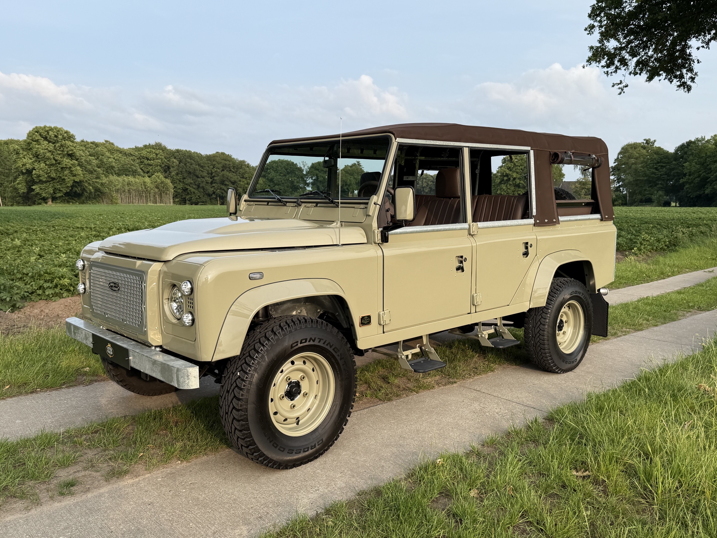 Cream River House Defender photographed in open countryside